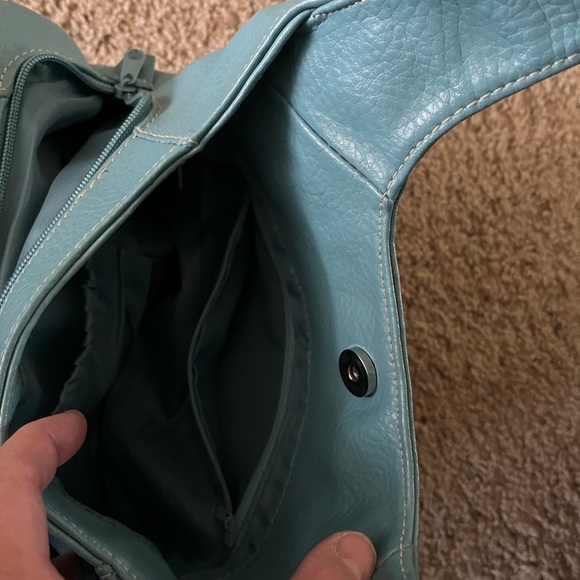 Turquoise colored shoulder bag. Has separate inside compartments. 13” X 9”. - Picture 3 of 5